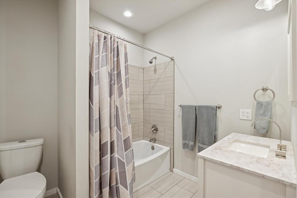 7232 Courtney Drive Azle, TX 76020 - Photo 29 of 39 a bathroom with a sink toilet and shower