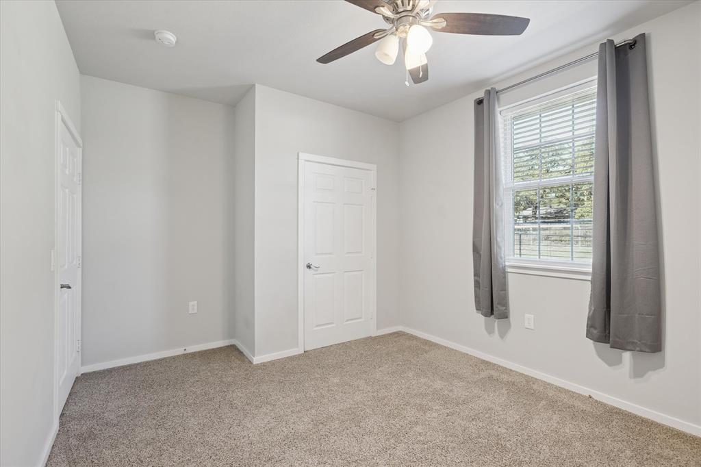 7232 Courtney Drive Azle, TX 76020 - Photo 30 of 39 a view of an empty room with a window