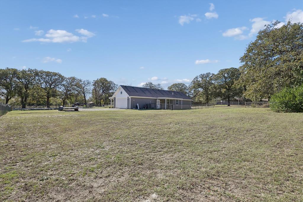 7232 Courtney Drive Azle, TX 76020 - Photo 36 of 39 a front view of a house with a yard