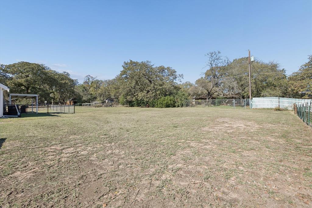 7232 Courtney Drive Azle, TX 76020 - Photo 38 of 39 a view of a field with trees in the background