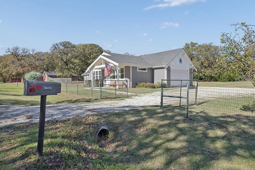7232 Courtney Drive Azle, TX 76020 - Photo 5 of 39 a front view of a house with garden
