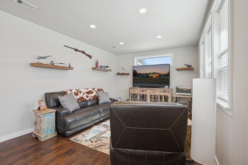 7232 Courtney Drive Azle, TX 76020 - Photo 7 of 39 a living room with furniture a flat screen tv and a window