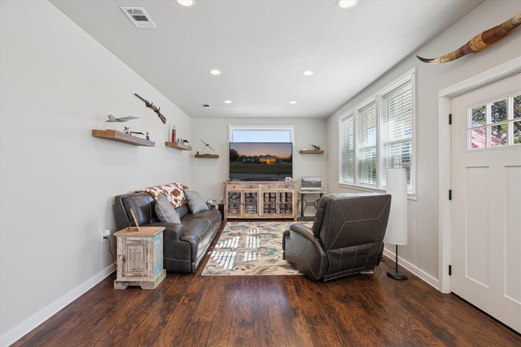 7232 Courtney Drive Azle, TX 76020 - Photo 8 of 39 a living room with furniture and a flat screen tv