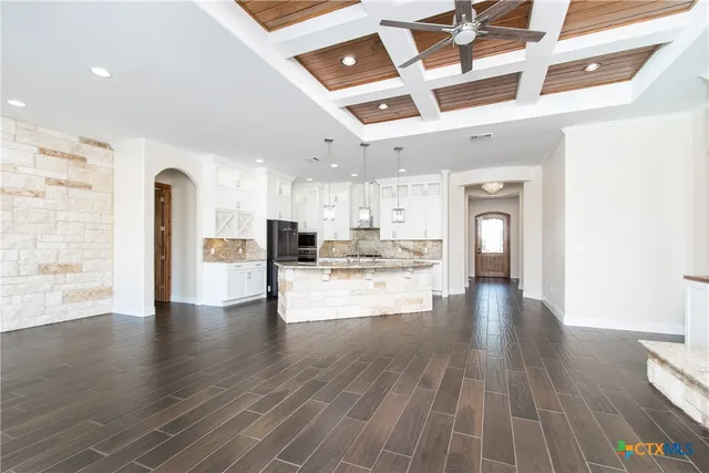 a view of kitchen with furniture and wooden floor