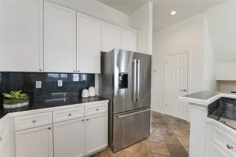 a kitchen with a sink stove and microwave