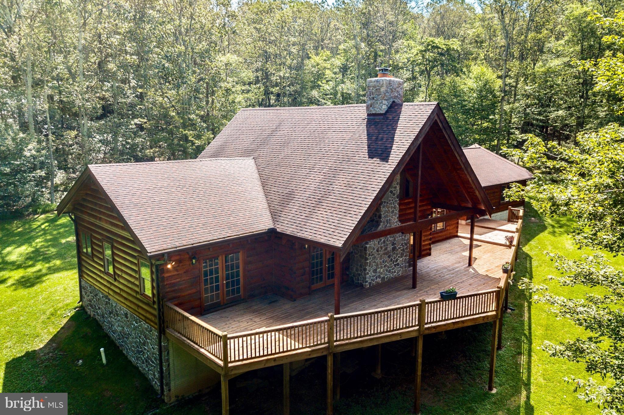 12002 Gambrill Park Road Frederick, MD 21702 - Photo 26 of 27 a view of a roof deck with table and chairs with wooden floor and fence