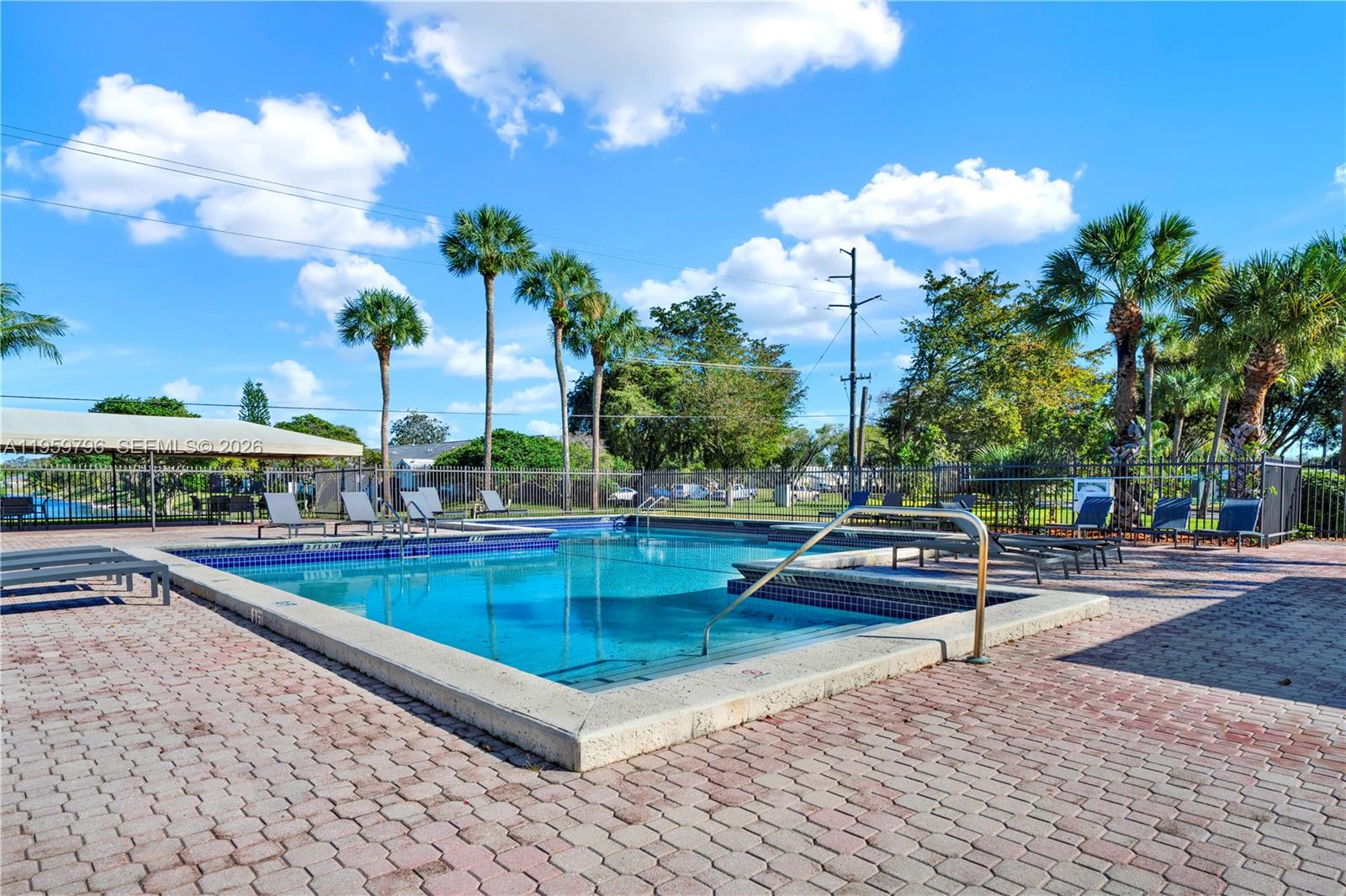 14600 Southwest 124th Place Miami, FL 33186 - Photo 26 of 34 a view of a patio with swimming pool