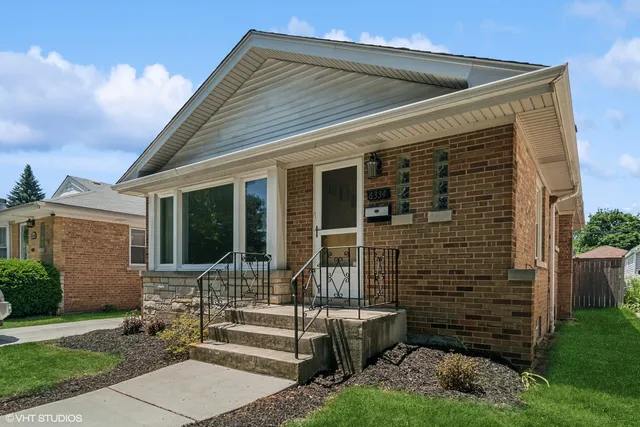 a view of house with backyard