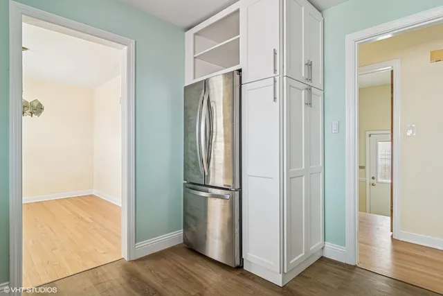 a view of entryway with wooden floor and door