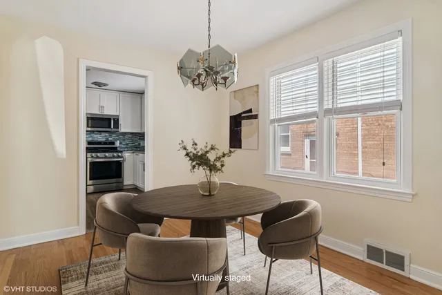 a dining room with furniture and window