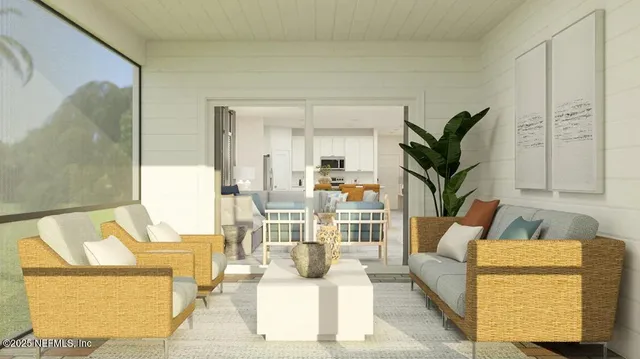 a living room with furniture and a potted plant