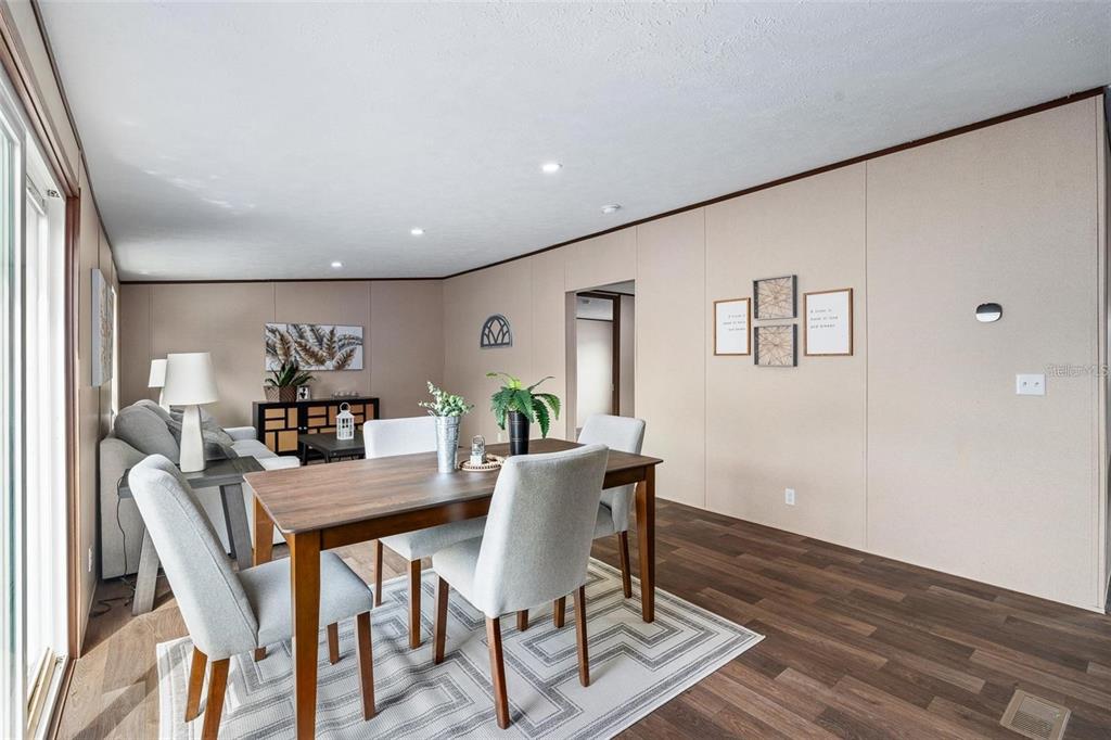 8150 Cherokee Road Bartow, FL 33830 - Photo 18 of 35 a view of a dining room with furniture window and wooden floor