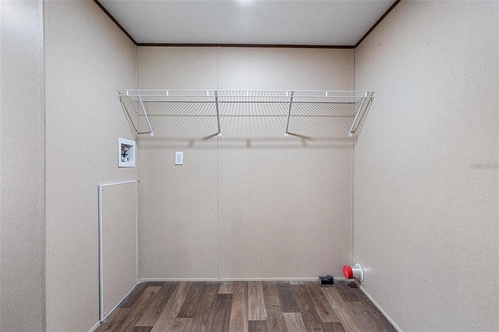 8150 Cherokee Road Bartow, FL 33830 - Photo 34 of 35 a view of storage and utility room with racks on the wall