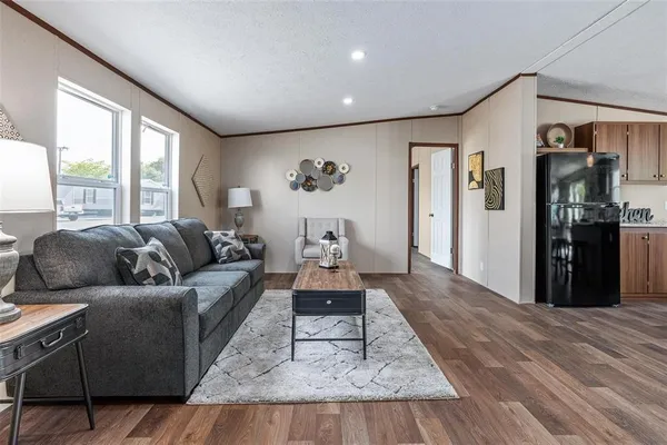 a living room with furniture and a rug