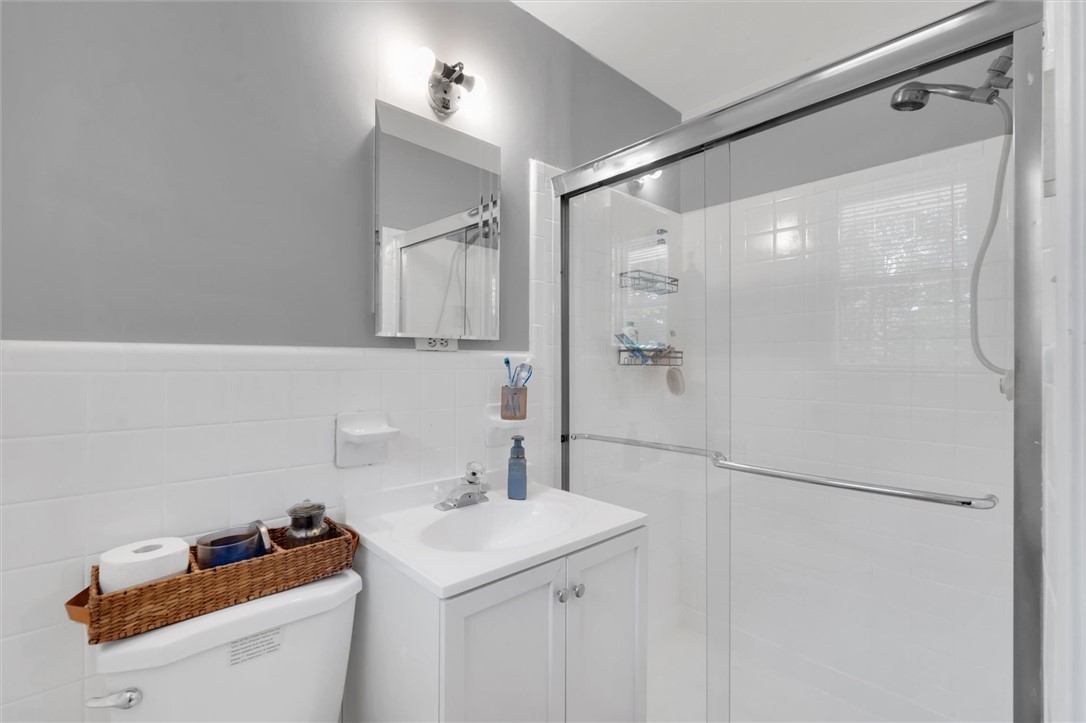 1815 Pearman Dairy Road Anderson, SC 29625 - Photo 17 of 35 A well-appointed bath features a bright vanity and a convenient glass-enclosed shower.