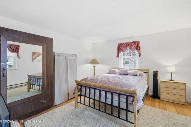 a bedroom with furniture and a baby crib