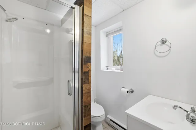 a bathroom with a sink and toilet
