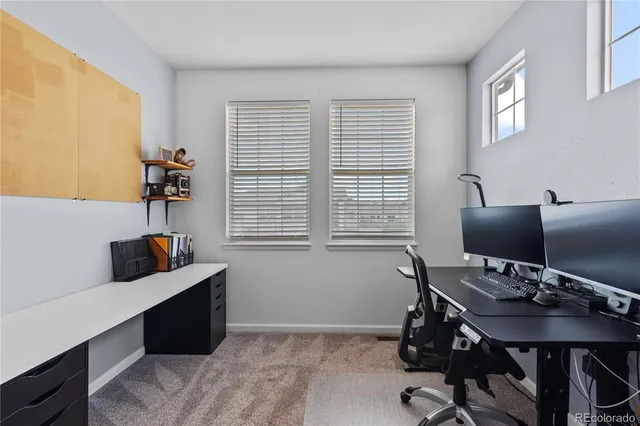 a work room with furniture and a window