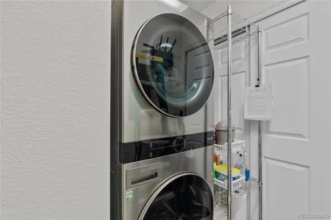 a close view of a utility room with dryer and washer