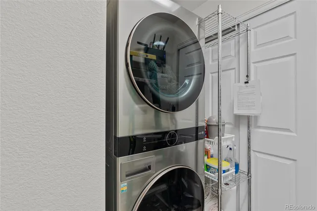a close view of a utility room with dryer and washer
