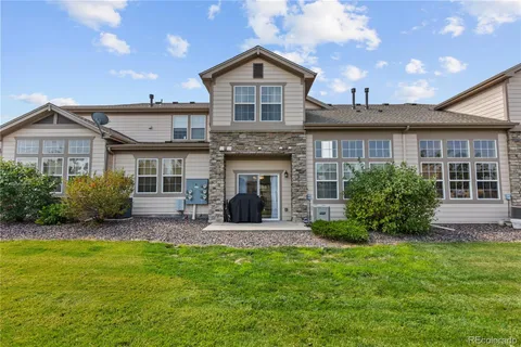 a front view of a house with garden and porch