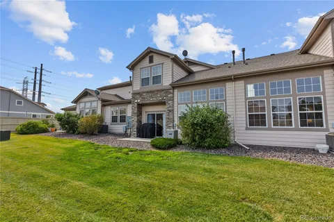a view of a house with a yard porch and sitting area