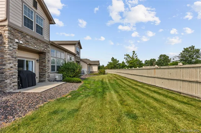 a view of an house with swimming pool and sitting area