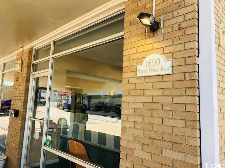 1600 South Ocean Boulevard, Unit 322 Myrtle Beach, SC 29577 - Photo 16 of 16 Doorway to property featuring brick siding