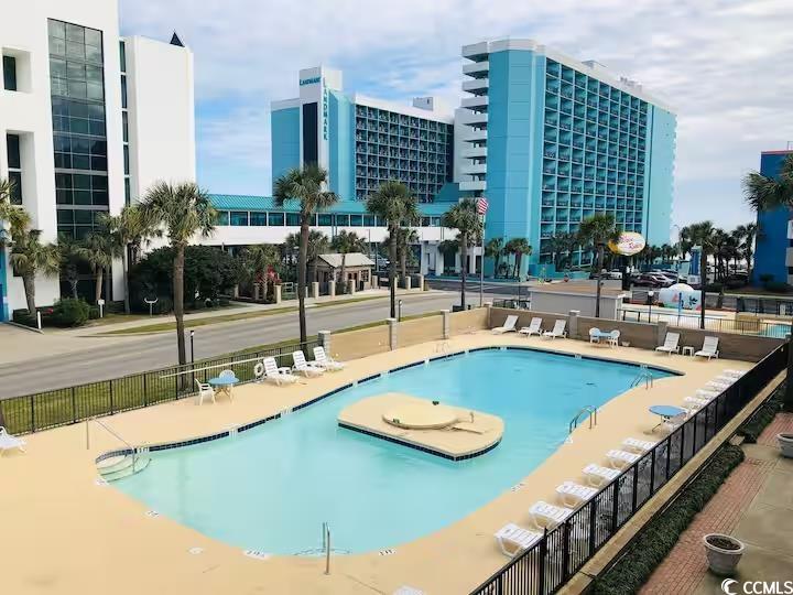 1600 South Ocean Boulevard, Unit 322 Myrtle Beach, SC 29577 - Photo 3 of 16 Community pool with a patio area