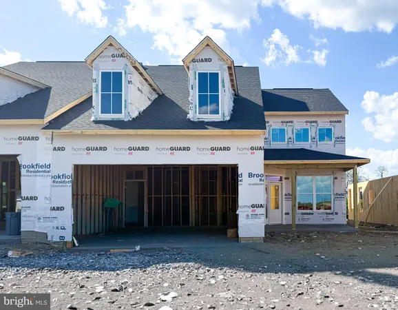 a view of a house with a yard and garage