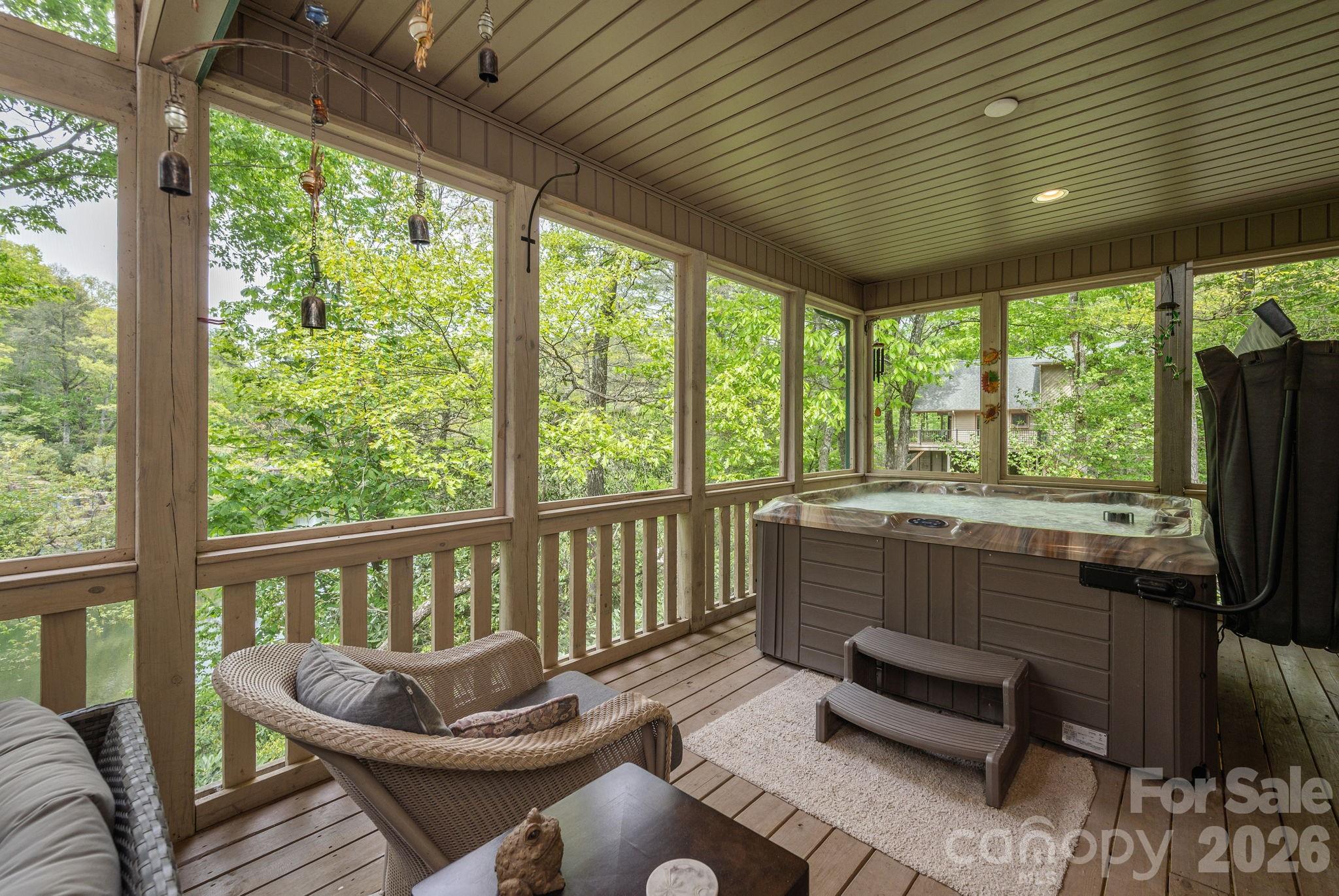 149 Hiwassee Road Lake Toxaway, NC 28747 - Photo 14 of 48 a living room with furniture and a floor to ceiling window