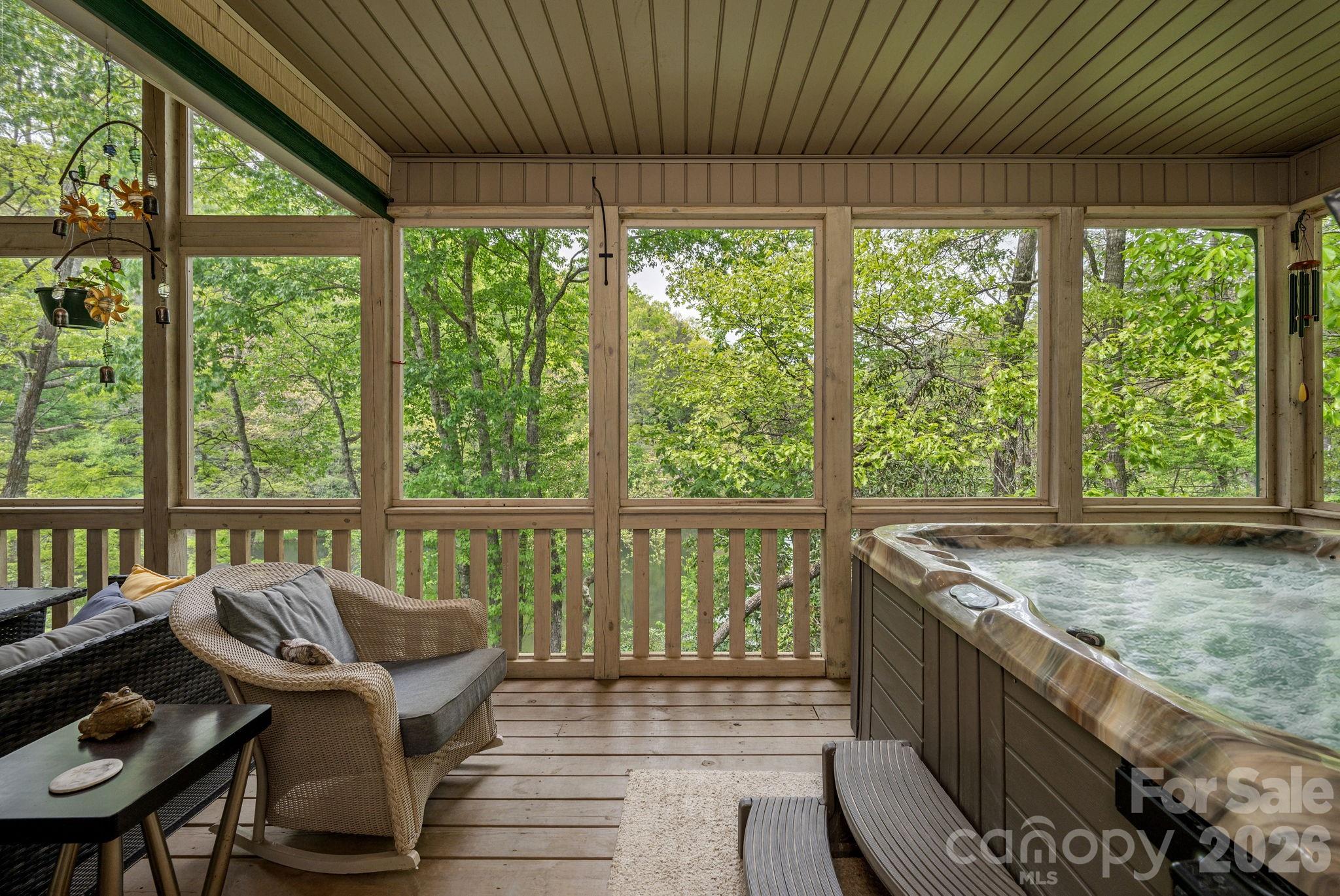 149 Hiwassee Road Lake Toxaway, NC 28747 - Photo 15 of 48 a living room with furniture and a floor to ceiling window