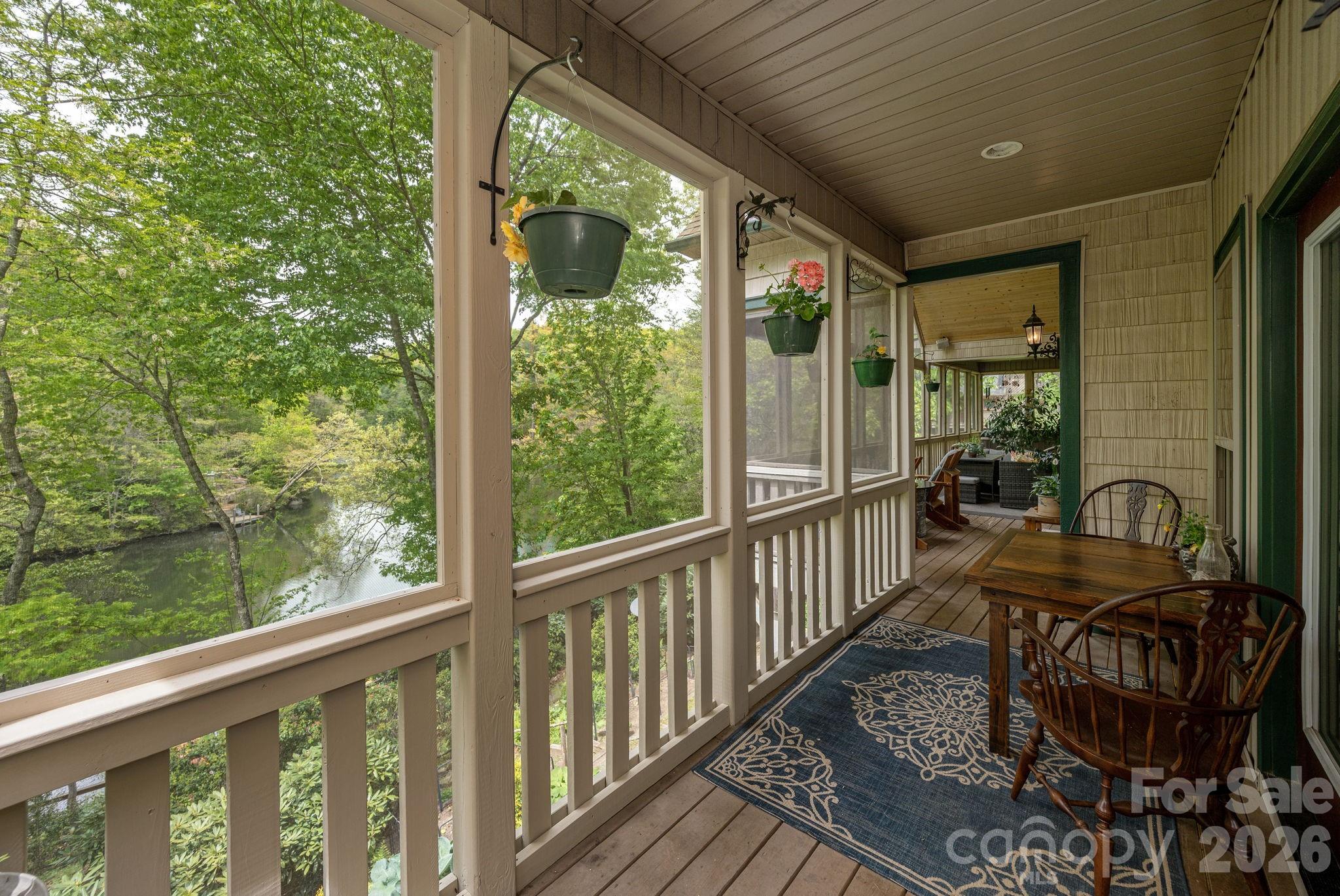 149 Hiwassee Road Lake Toxaway, NC 28747 - Photo 16 of 48 a view of a chairs and table in patio of the house