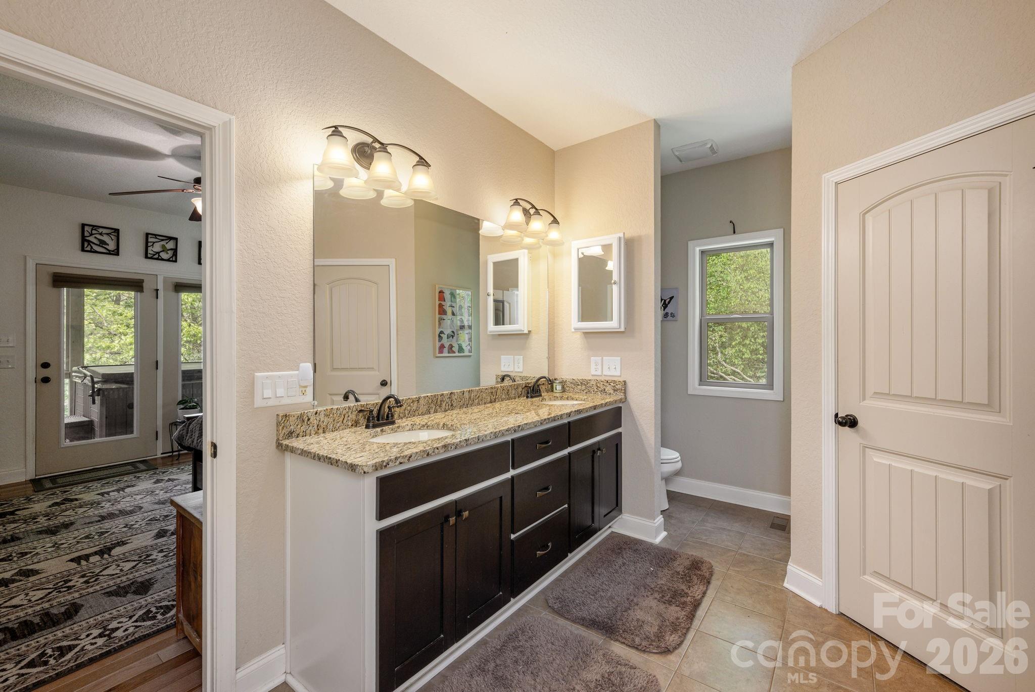 149 Hiwassee Road Lake Toxaway, NC 28747 - Photo 24 of 48 a bathroom with a sink and a mirror