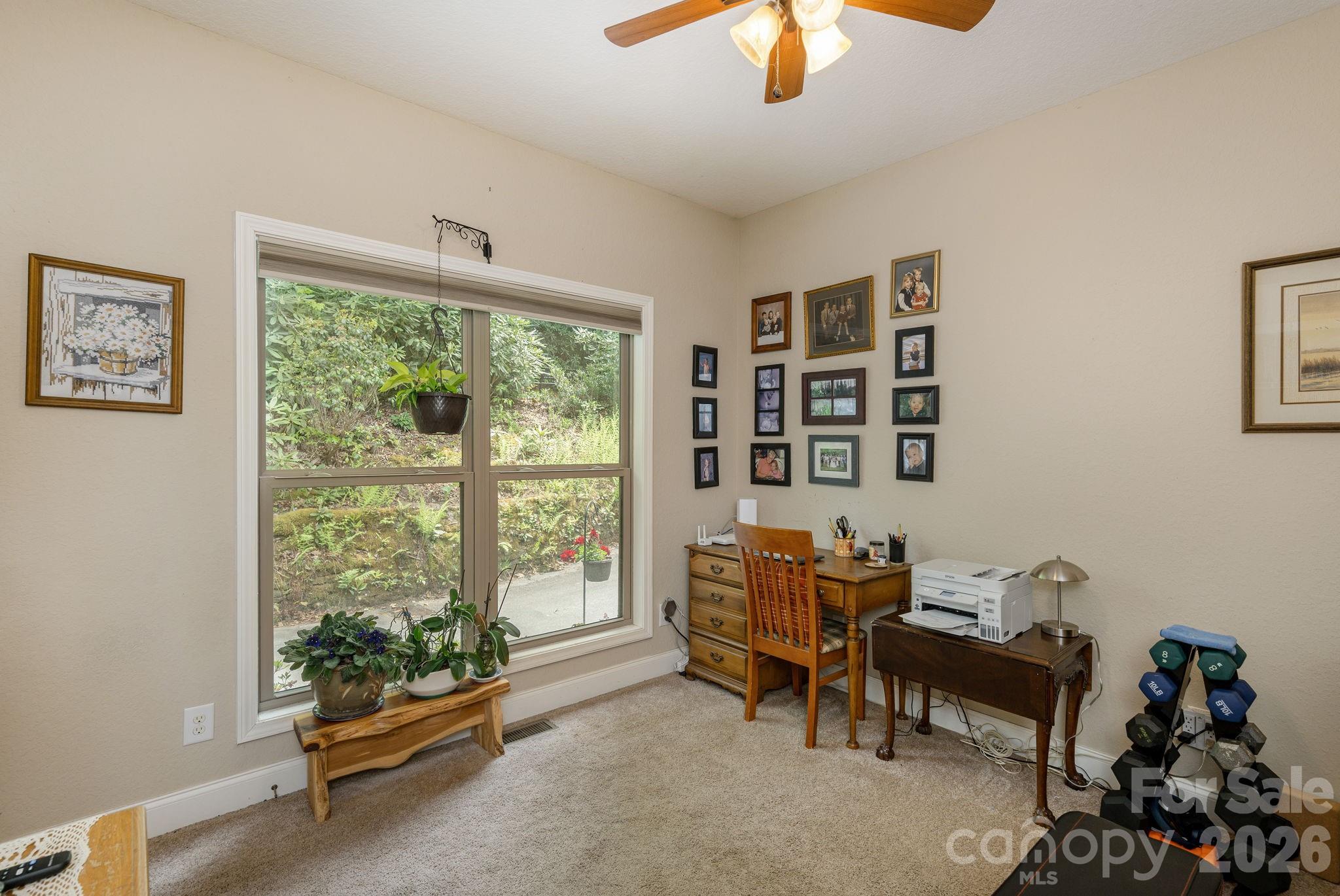 149 Hiwassee Road Lake Toxaway, NC 28747 - Photo 27 of 48 a living room with furniture and floor to ceiling windows