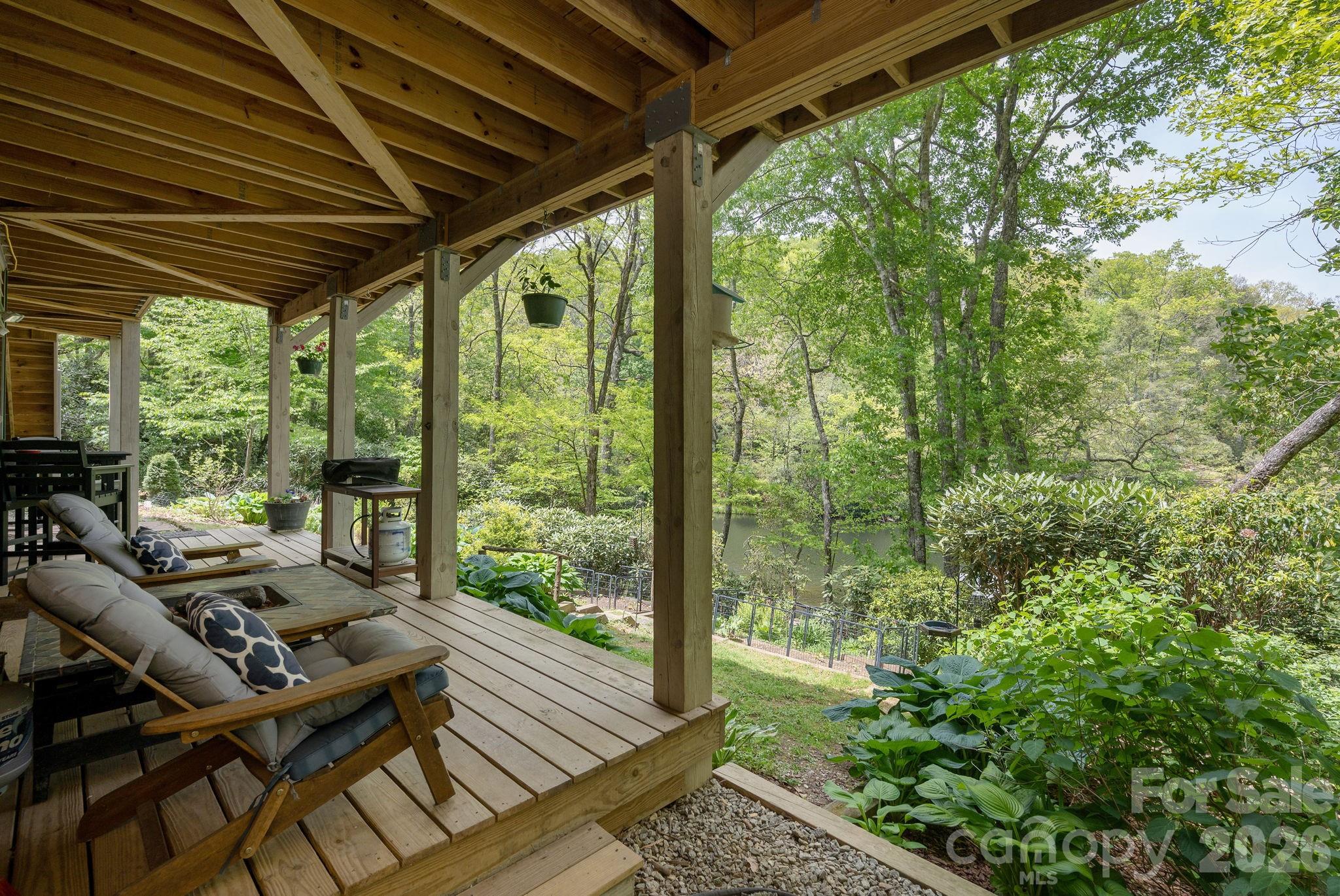 149 Hiwassee Road Lake Toxaway, NC 28747 - Photo 35 of 48 a outdoor living space with furniture and garden view