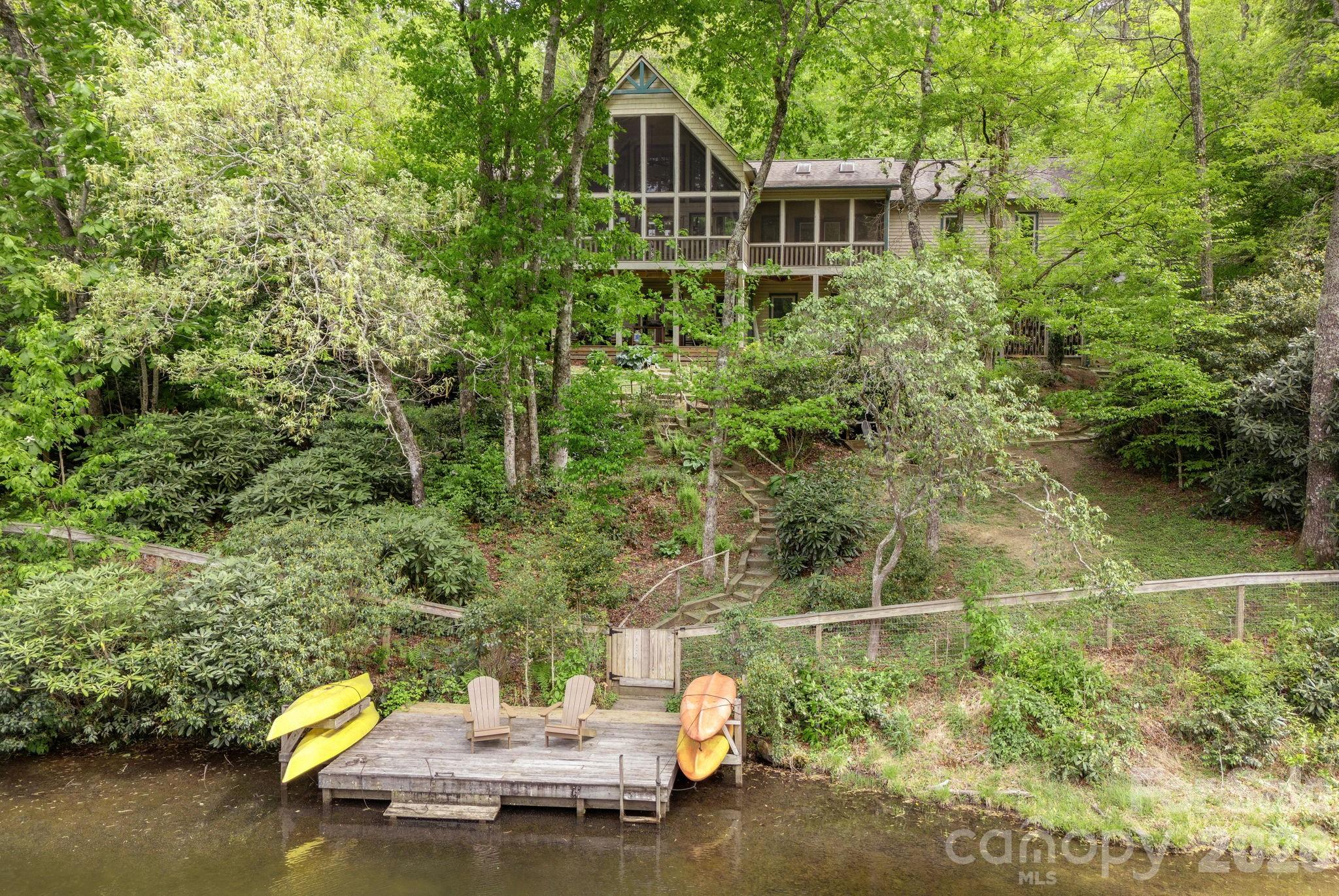 149 Hiwassee Road Lake Toxaway, NC 28747 - Photo 42 of 48 a view of a house with swimming pool next to a yard
