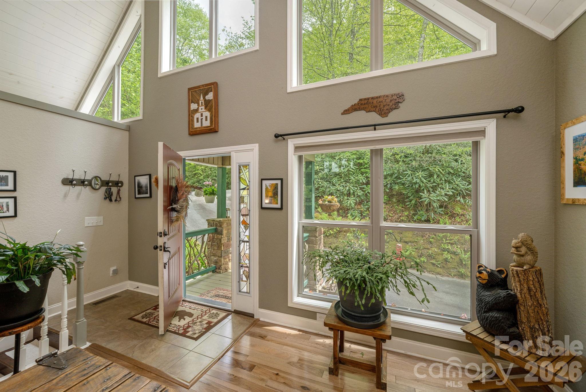 149 Hiwassee Road Lake Toxaway, NC 28747 - Photo 5 of 48 a living room with furniture and a window