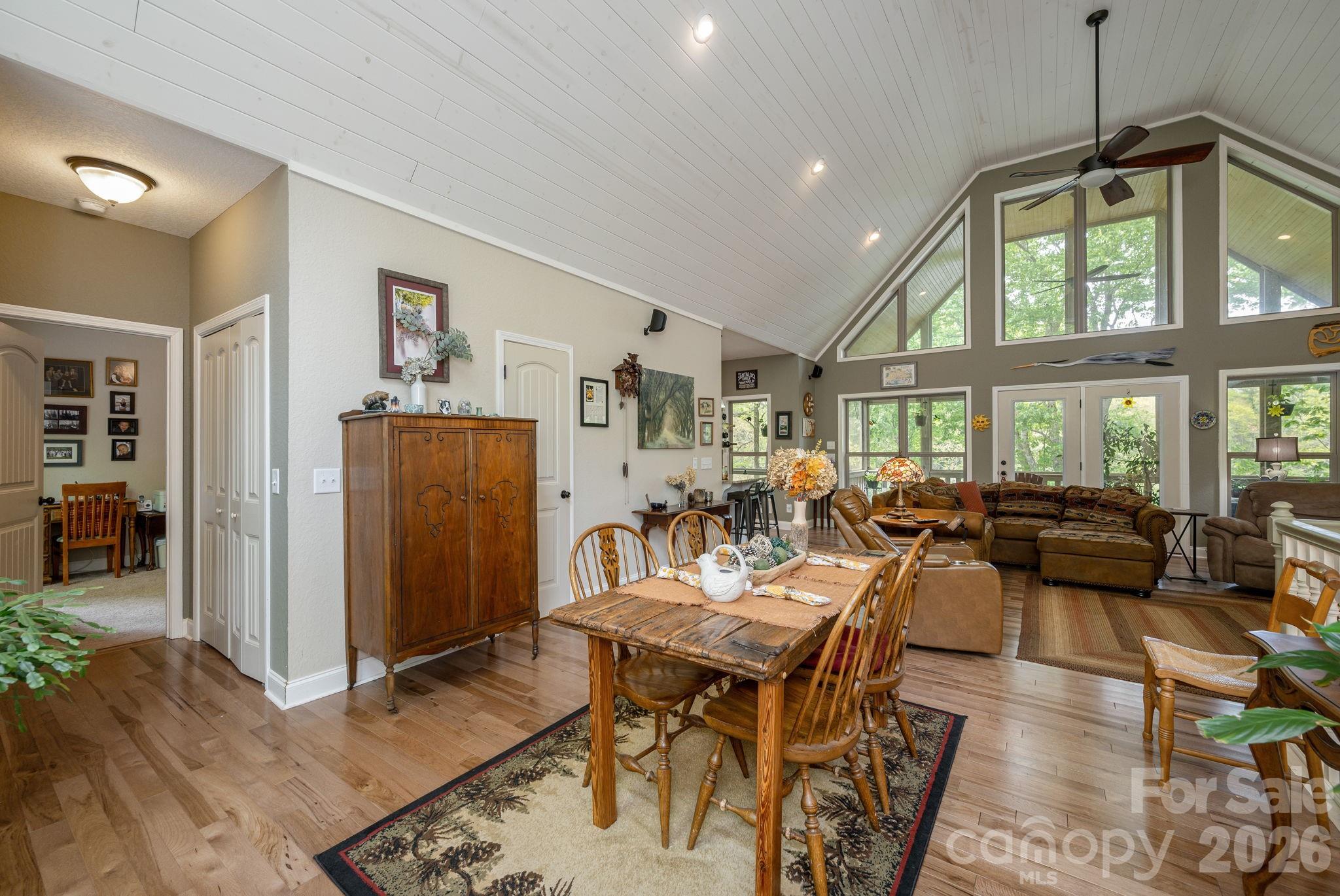 149 Hiwassee Road Lake Toxaway, NC 28747 - Photo 7 of 48 a living room with furniture a window and a chandelier