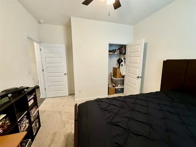 a bedroom with a bed and a closet