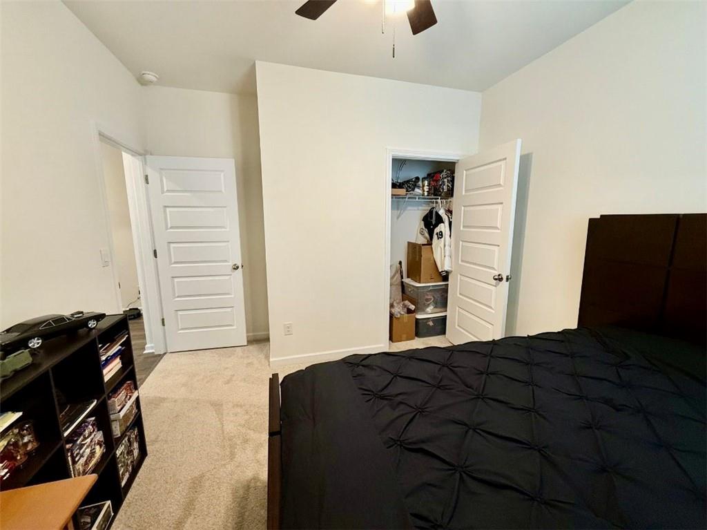 2015 Waycross Lane Dacula, GA 30019 - Photo 14 of 49 a bedroom with a bed and a closet
