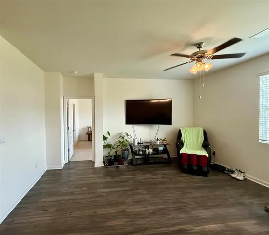 a room with furniture and a flat screen tv