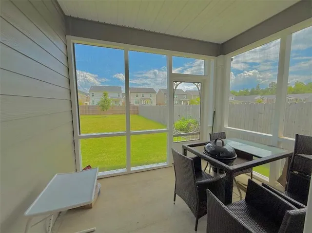 a room with furniture and a window