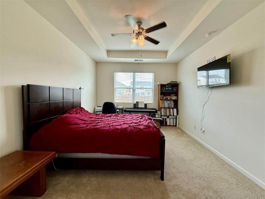 2015 Waycross Lane Dacula, GA 30019 - Photo 27 of 49 a bedroom with a bed and a tv