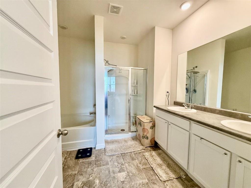 2015 Waycross Lane Dacula, GA 30019 - Photo 30 of 49 a bathroom with a granite countertop sink mirror bathtub and toilet