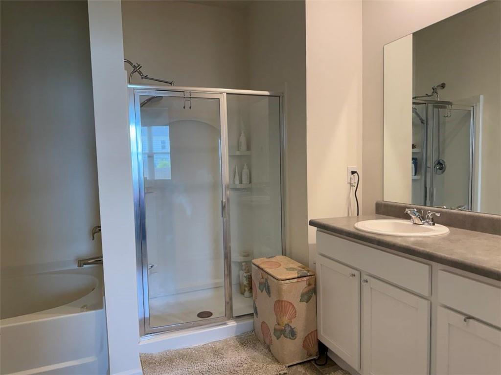 2015 Waycross Lane Dacula, GA 30019 - Photo 32 of 49 a bathroom with a granite countertop sink toilet and shower
