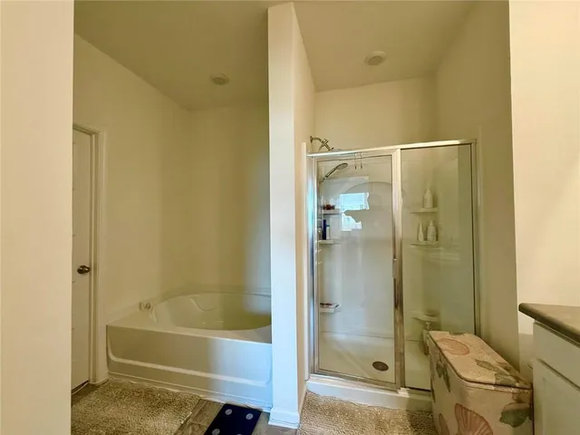 a bathroom with a shower and a toilet