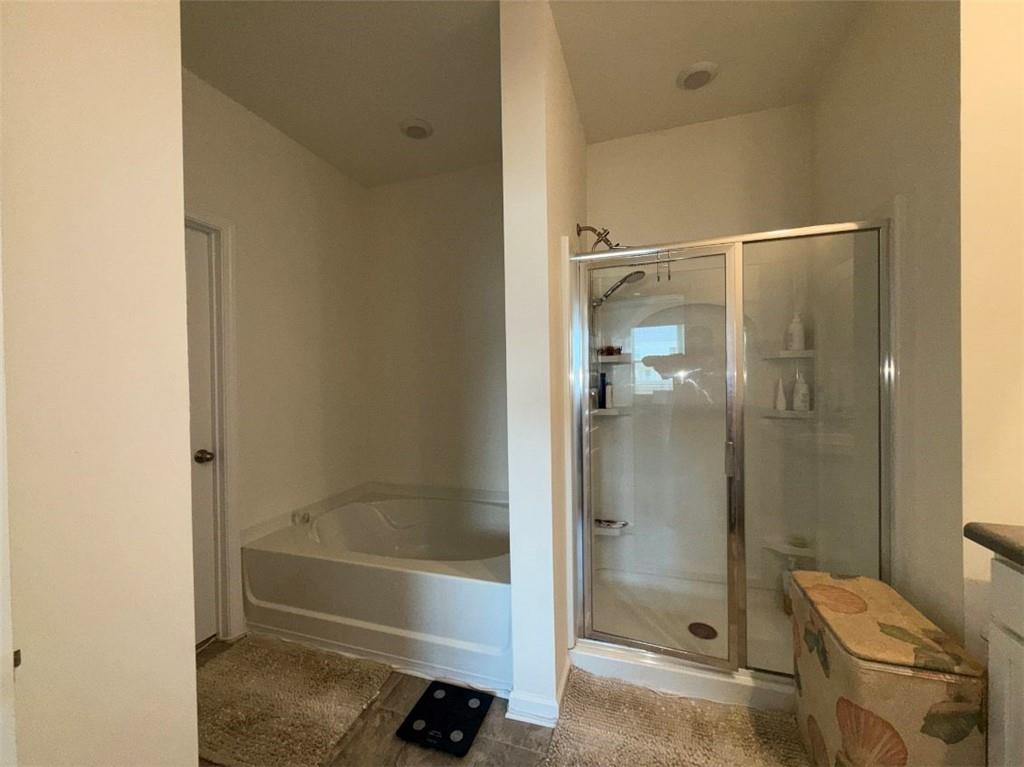 2015 Waycross Lane Dacula, GA 30019 - Photo 34 of 49 a bathroom with a bathtub and a shower
