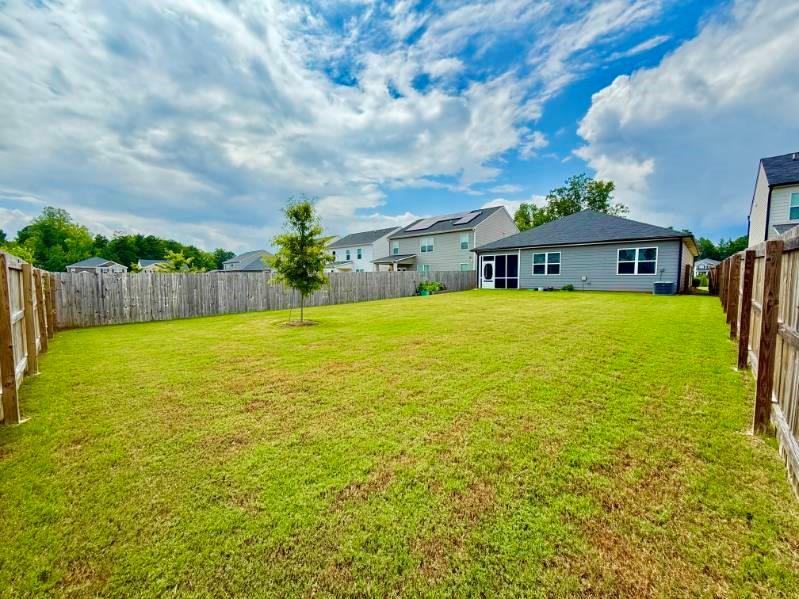 2015 Waycross Lane Dacula, GA 30019 - Photo 39 of 49 a view of house with a garden