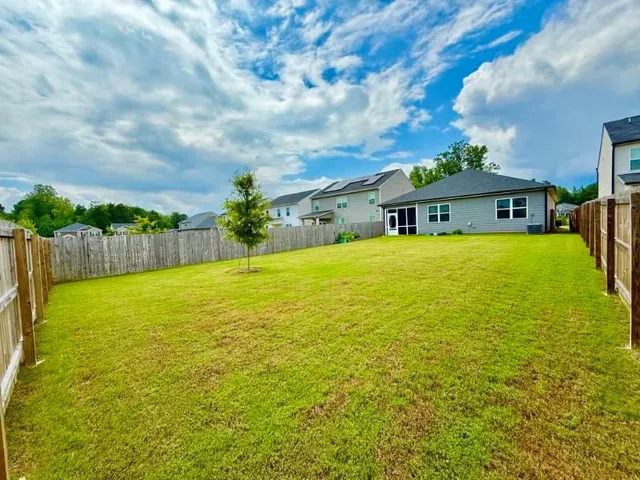 a view of a patio with a yard